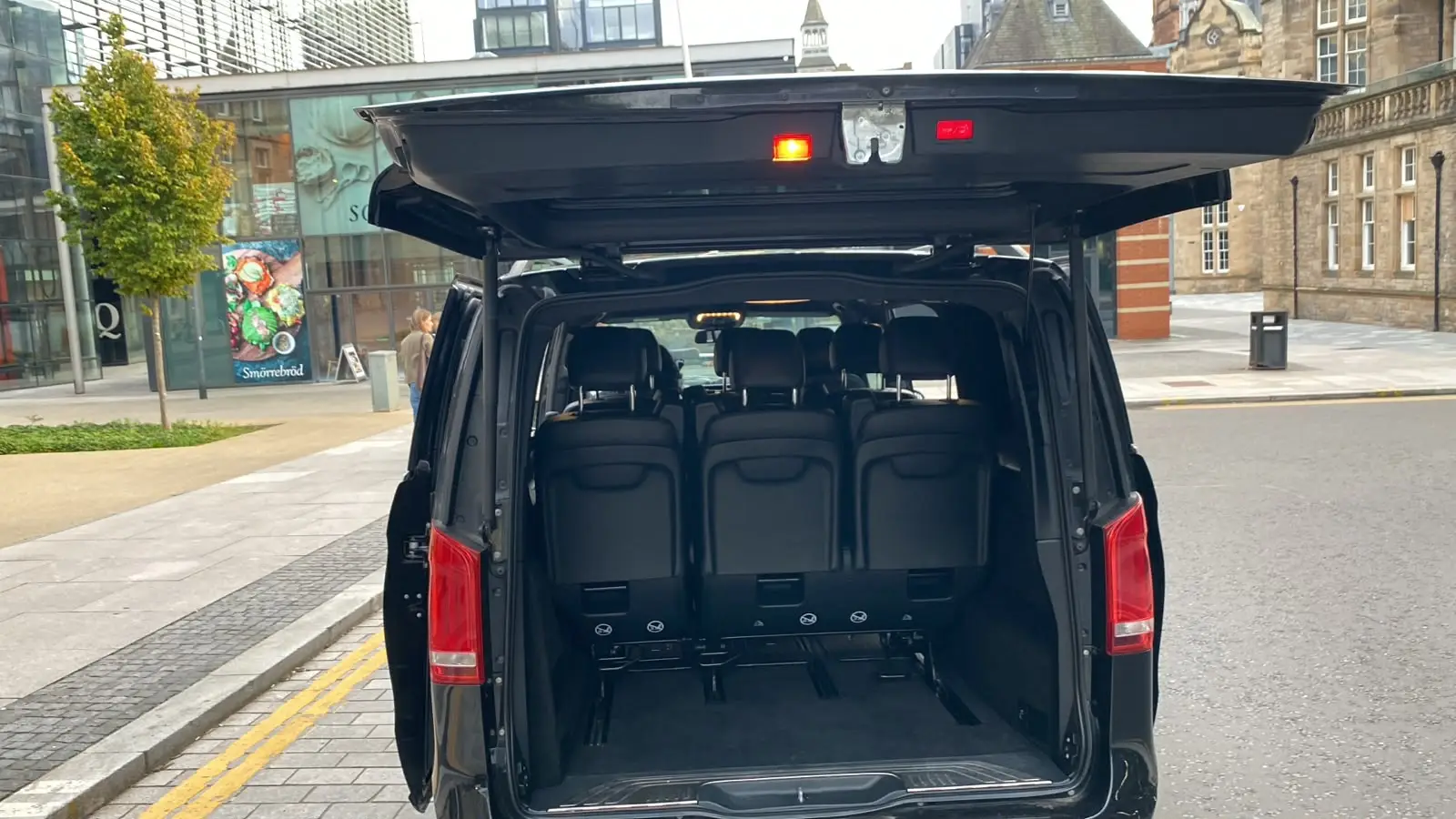 The boot open, with room for luggage behind the rear seats