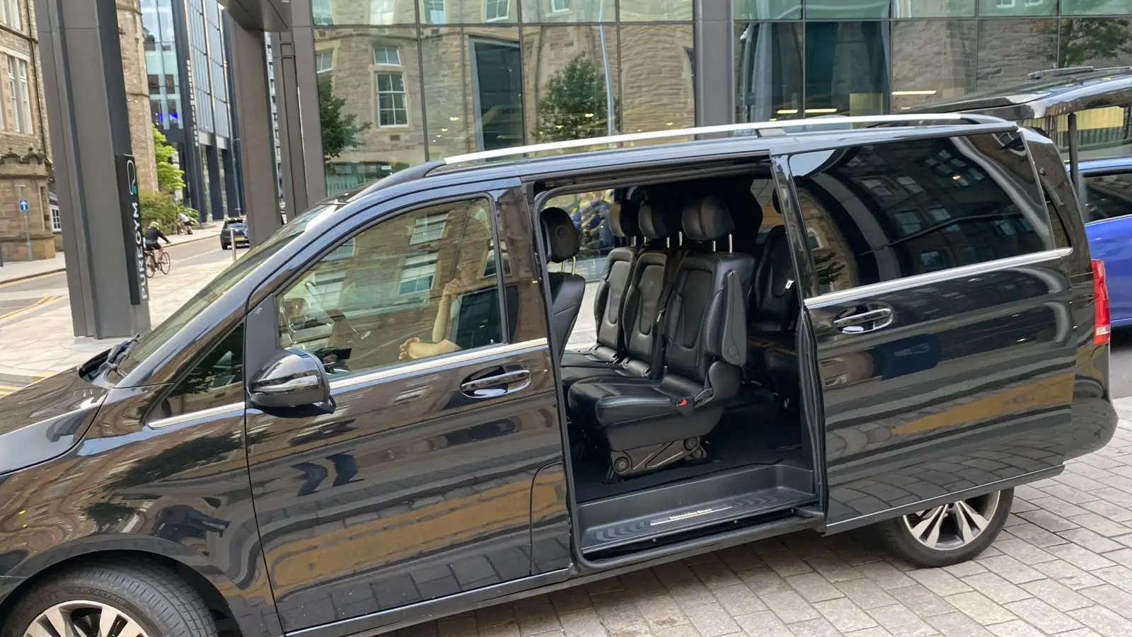 The V-Class with its sliding door open onto the passenger seats